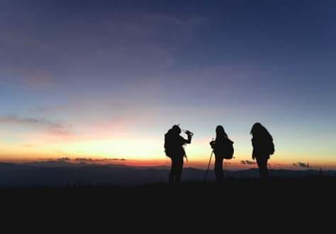 people taking photo of sunset