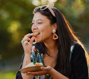 smiley girl eating snacks