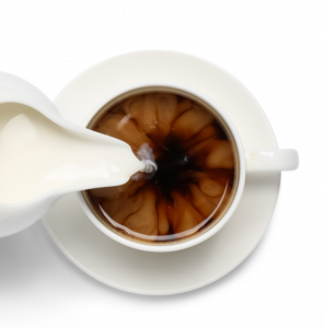 A cup of coffee with creamer