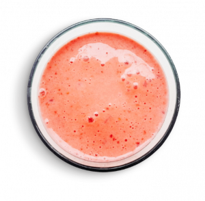 A glass of smoothie with milk