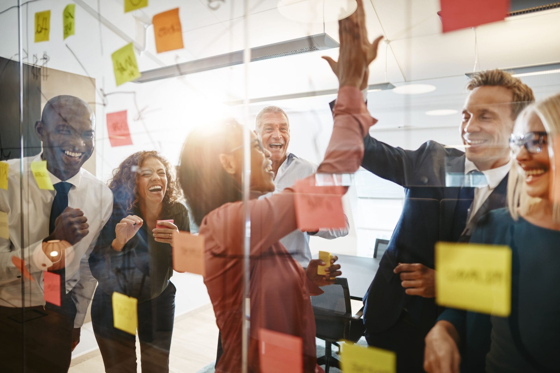 businesspeople-high-fiving-together-with-colleague-2024-09-16-14-14-41-utc