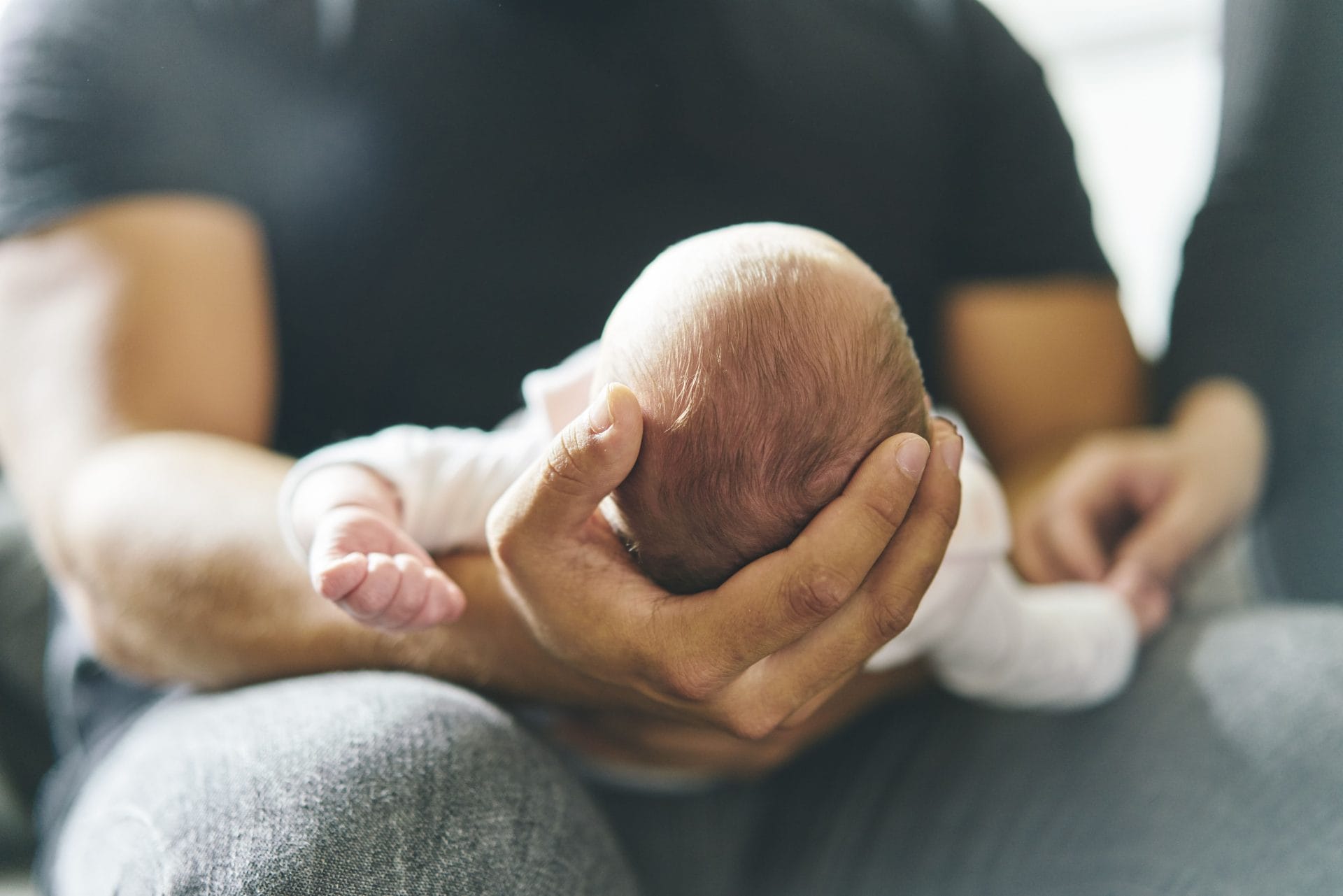 father-cradling-a-newborn-baby-in-his-arms-2024-07-03-18-40-36-utc