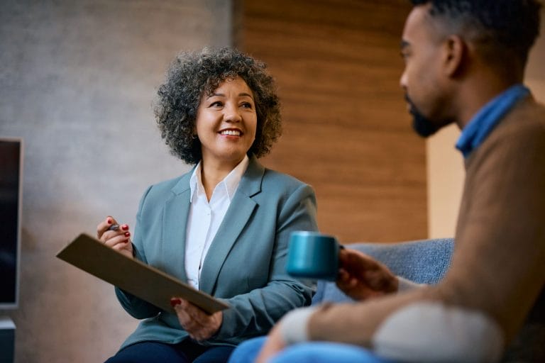 happy-financial-advisor-having-a-meeting-with-her-2023-11-27-05-02-21-utc