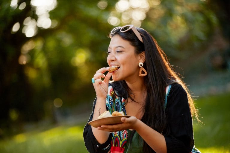 A woman eating snacks