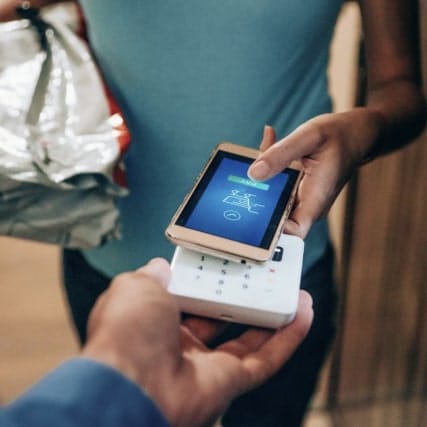 A phone tapping on a terminal