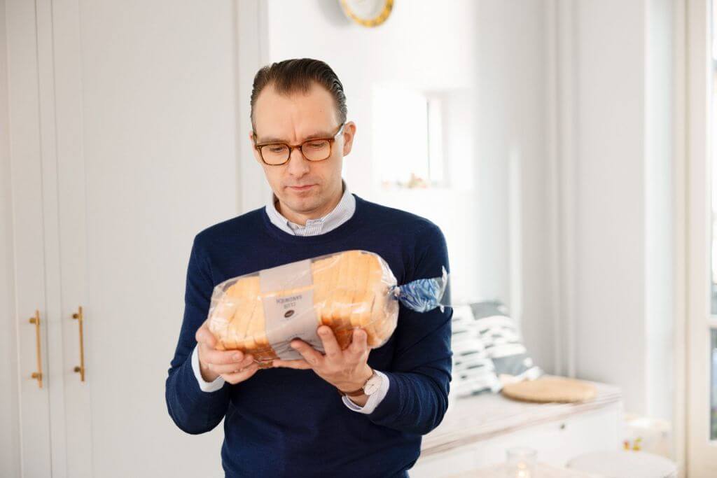 Men with loaf bread in his hands