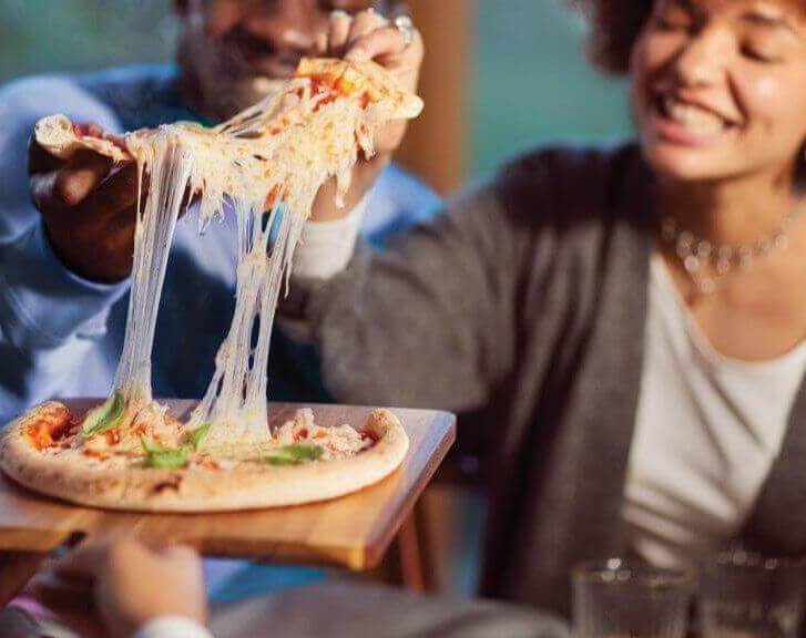 Family sharing pizza