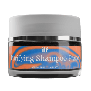 A jar of IFF Xelestia cosmetic formulation Purifying Shampoo Paste with a gray lid and an orange and blue label.