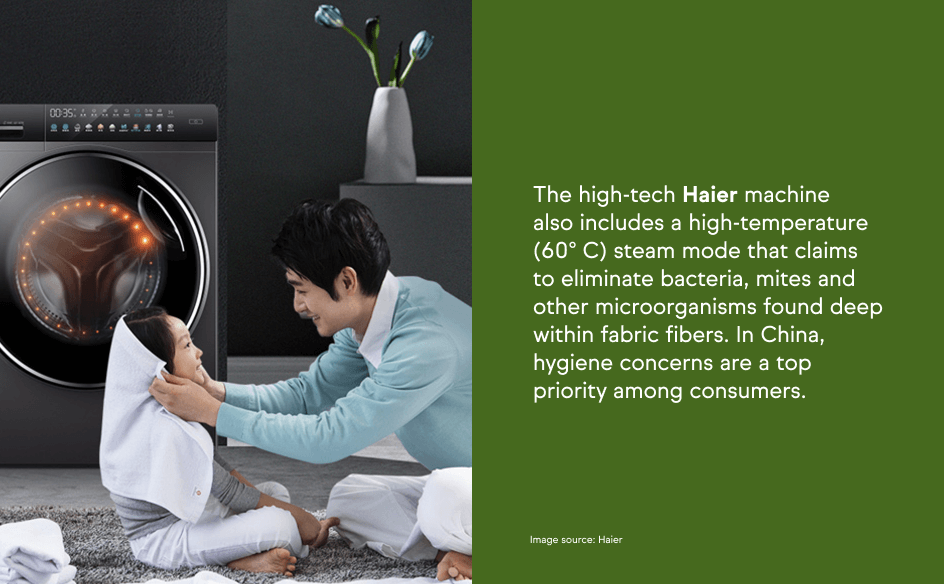 A man wrapping a towel around a child’s head with a Haier washing machine in the background, emphasizing hygiene-focused laundry technology.