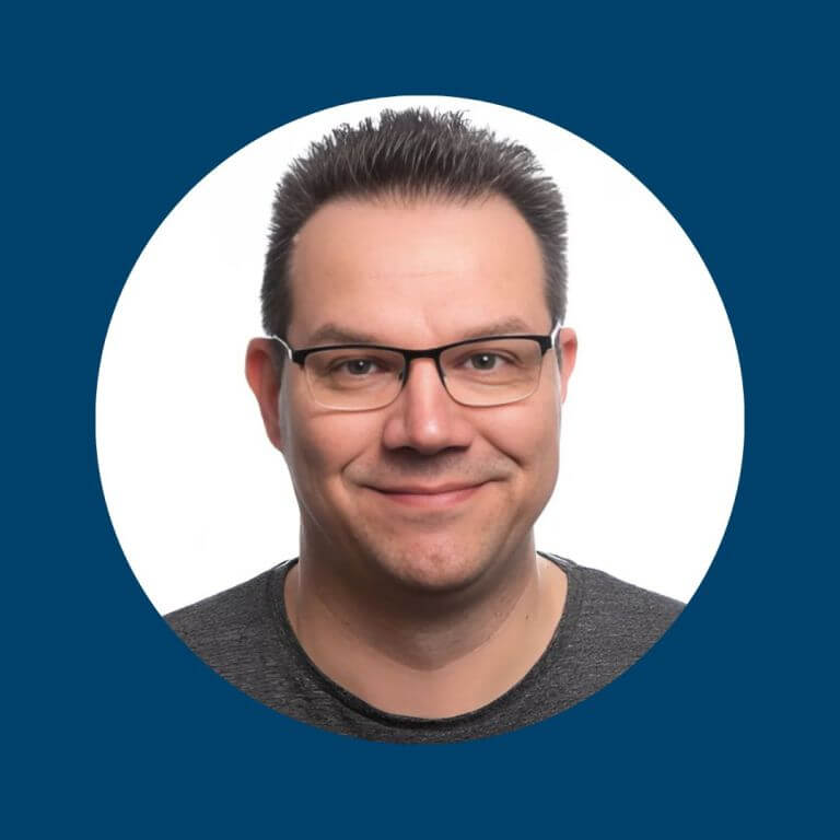 Headshot of Antti Kosola with short, dark hair and a dark shirt, face blurred, framed in a circle on a blue background.