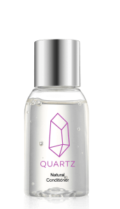 A clear bottle with a silver cap containing a liquid product. The label features a purple geometric crystal design and the word 