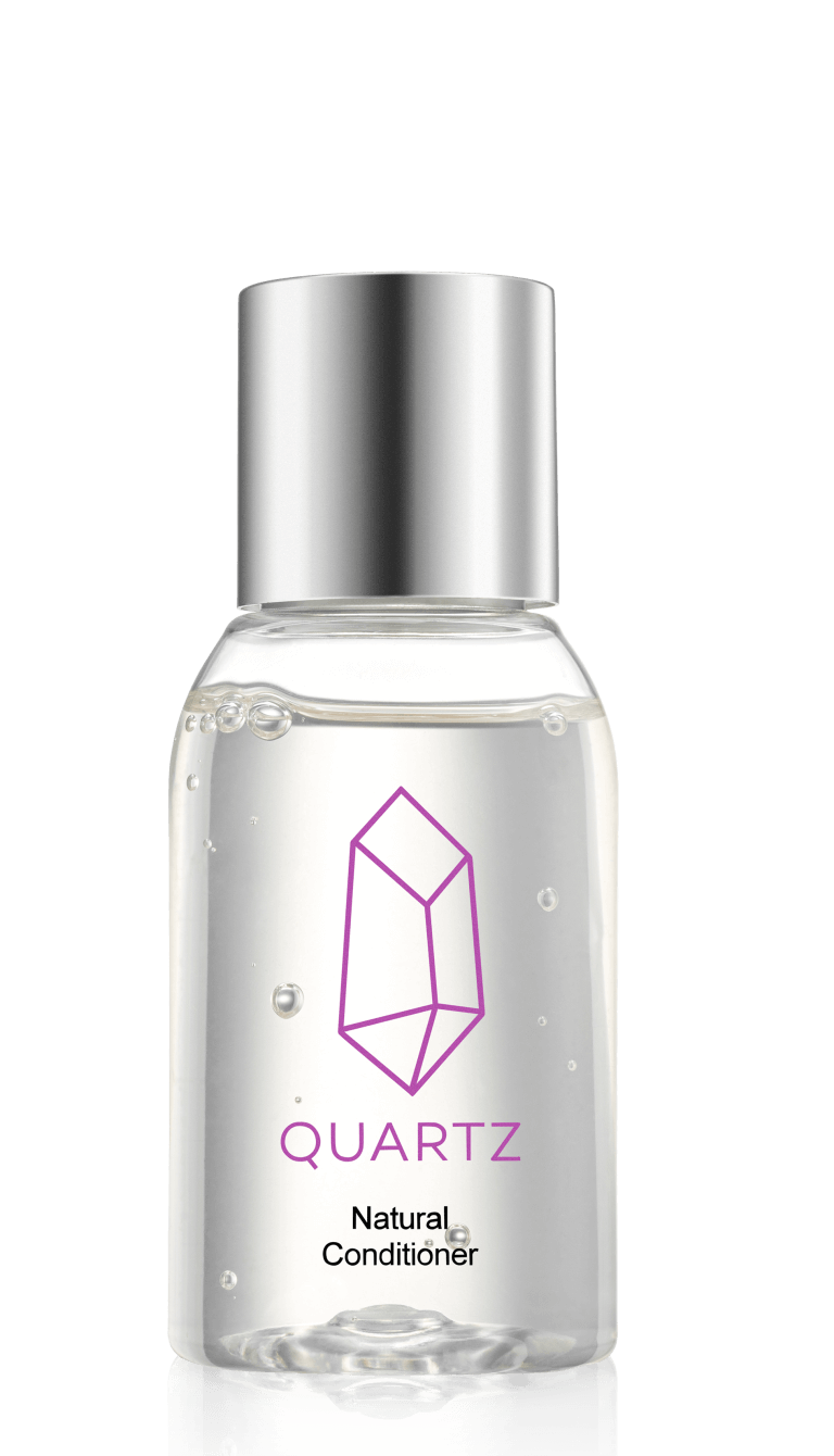 A clear bottle with a silver cap containing a liquid product. The label features a purple geometric crystal design and the word 