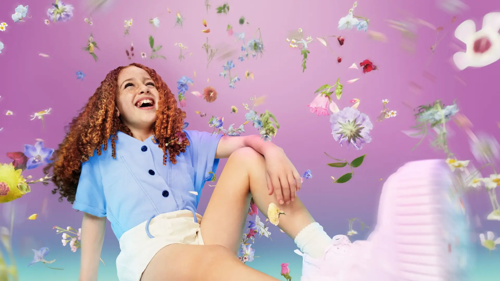 Young girl in clean clothes surrounded by flowers and petals against a pink background, symbolizing freshness and cleanliness.
