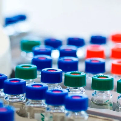 Close up of bioscience laboratory visuals with colorful caps used for sustainable laundry enzyme research.