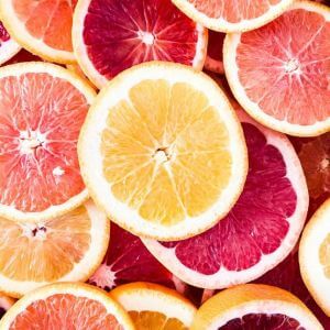 A close-up view of various citrus fruit slices, including oranges, grapefruits, and blood oranges.