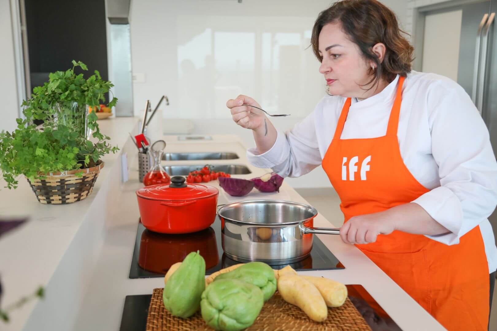 IFF team member cooking in the kitchen at the Sao Paulo, Brazil, location