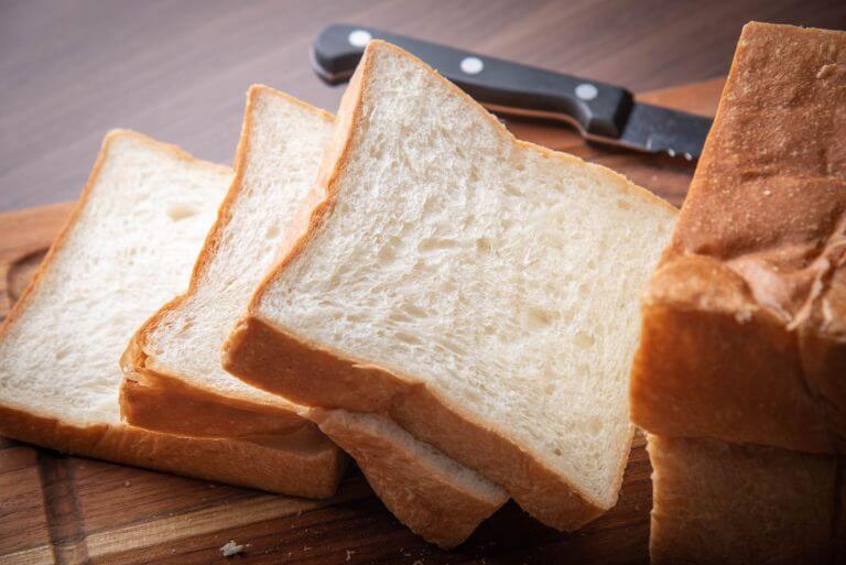 Slides of industrial bread. Baking enzymes that improve dough strength and stability with POWERBAKE® enzymes.