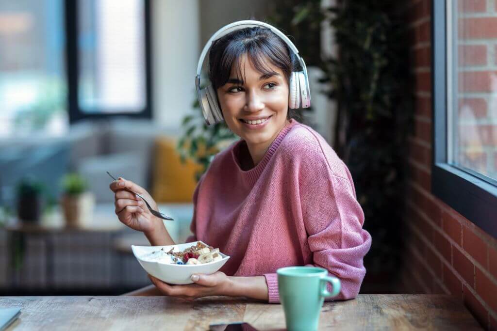 young girl eating a yogurt