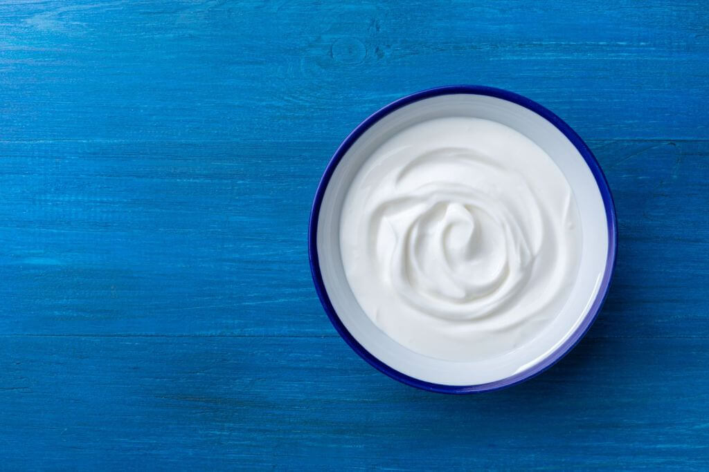 creamy yogurt blue background