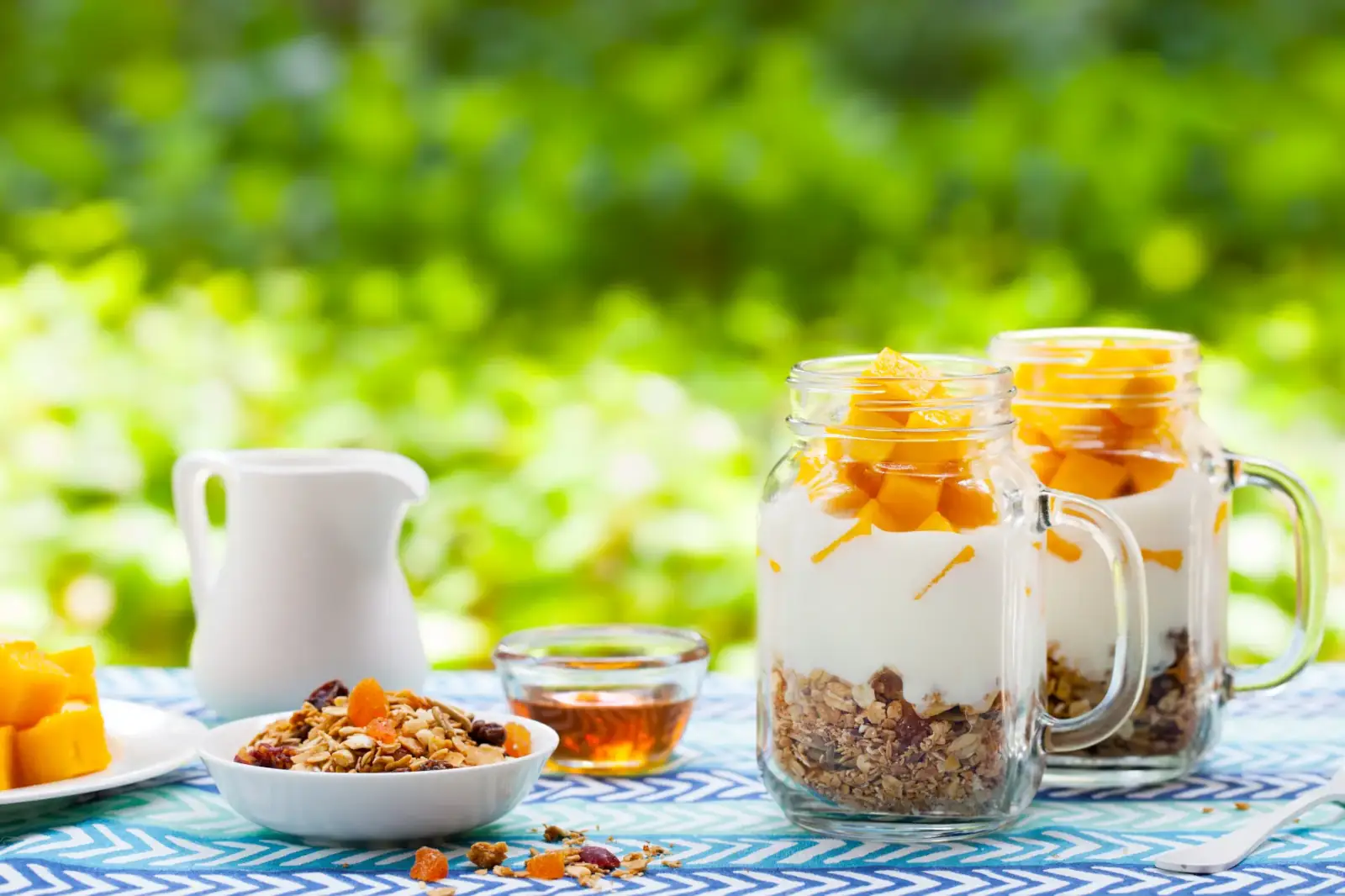 delicious-mango-yogurt-parfaits-on-a-picnic-table-2026-09-24-04-58-40-utc