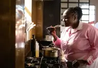 woman-cooking-food-in-kitchen-with-wooden-spoon-2026-09-24-14-01-08-utc
